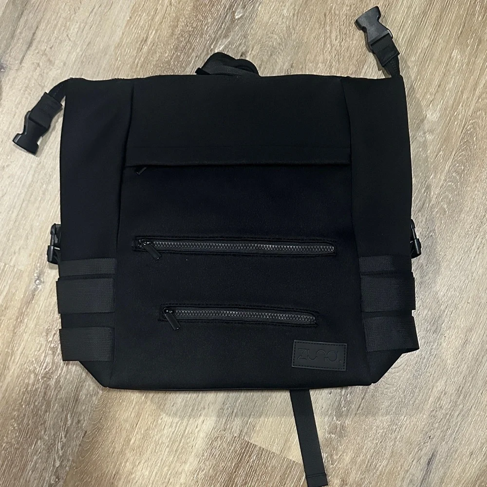 Black Multipocket neoprene baby diaper bag. Comes with extra bag / changing mat